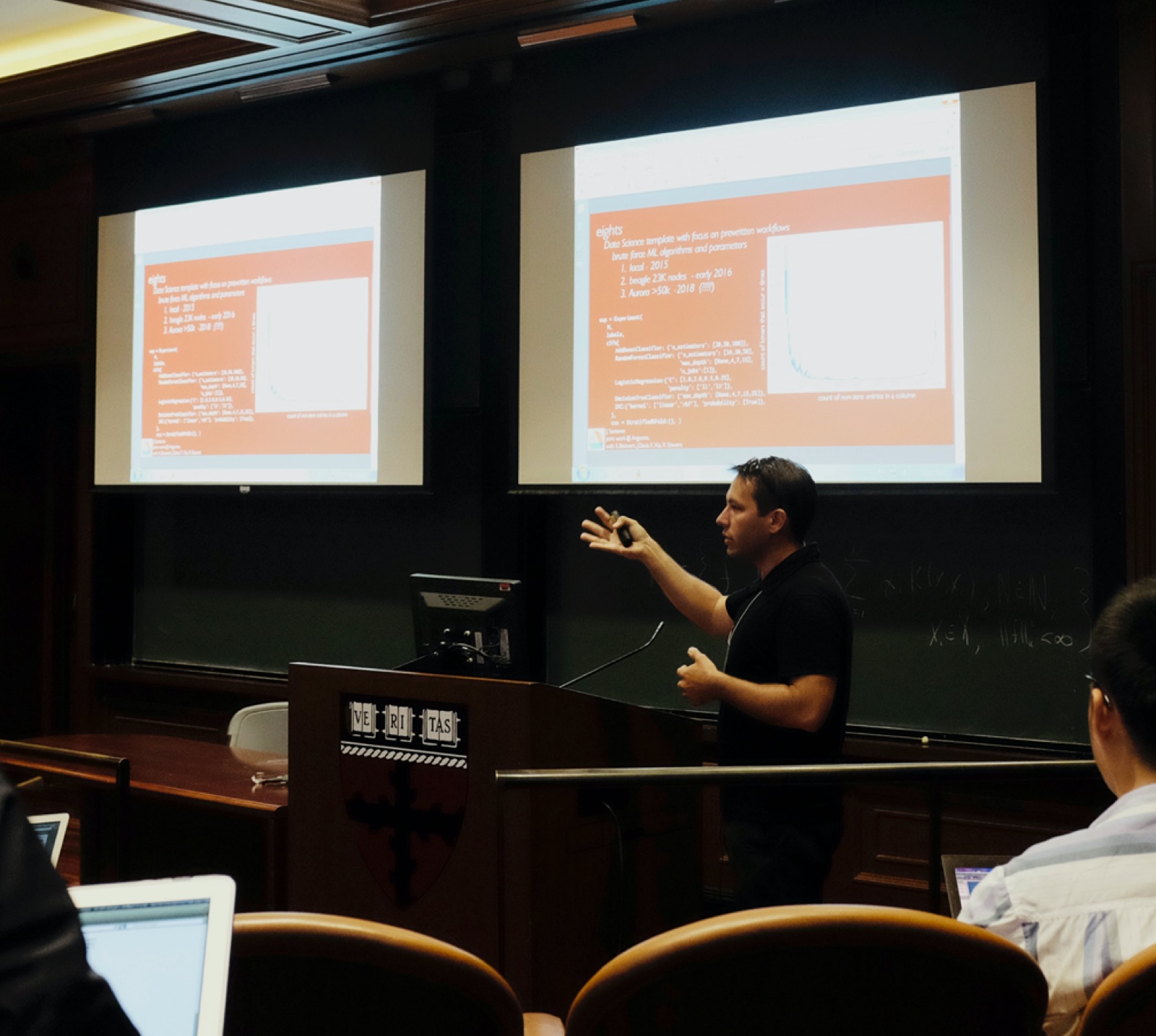 John Santerre presenting to a lecture hall at Harvard
