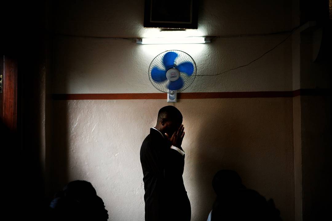 Keeping cool in a church in Haiti in 2008. Photo 7 of 22