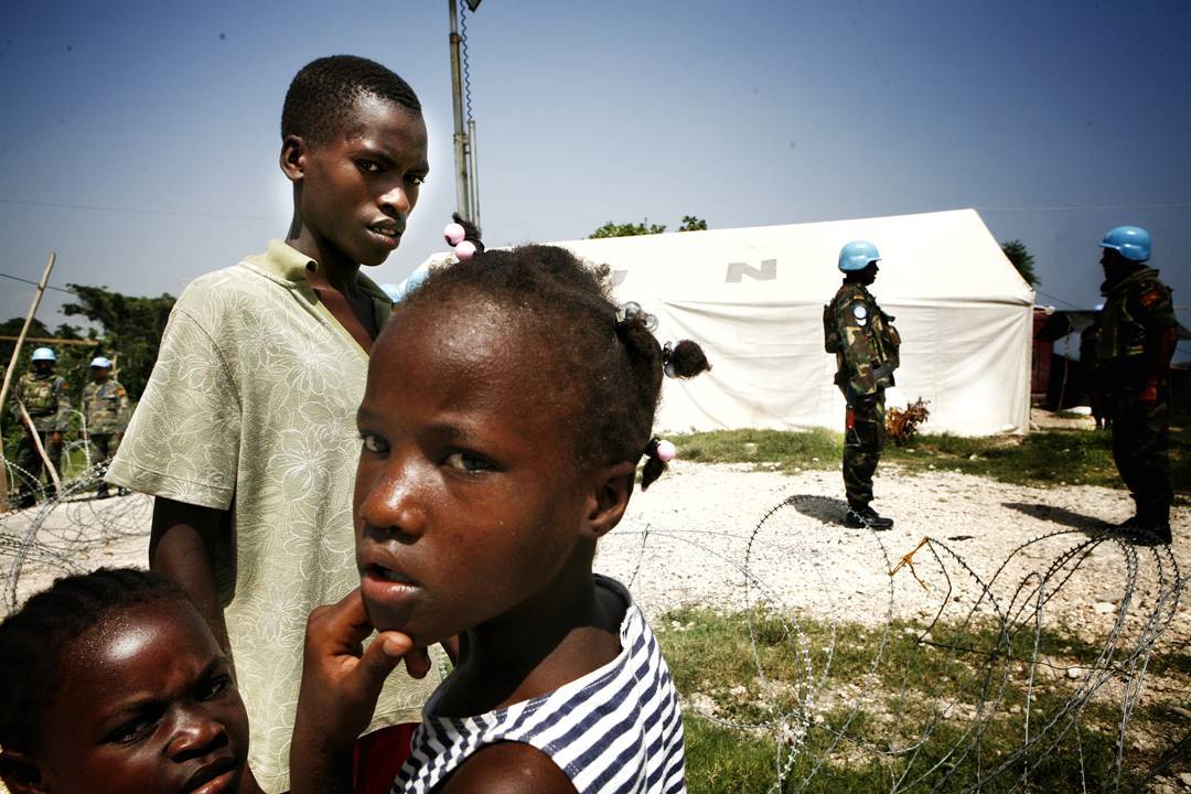 Sri Lankan soldiers working for the UN prepare for patrol in Haiti in 2008. The lack of separation(in all ways other tha