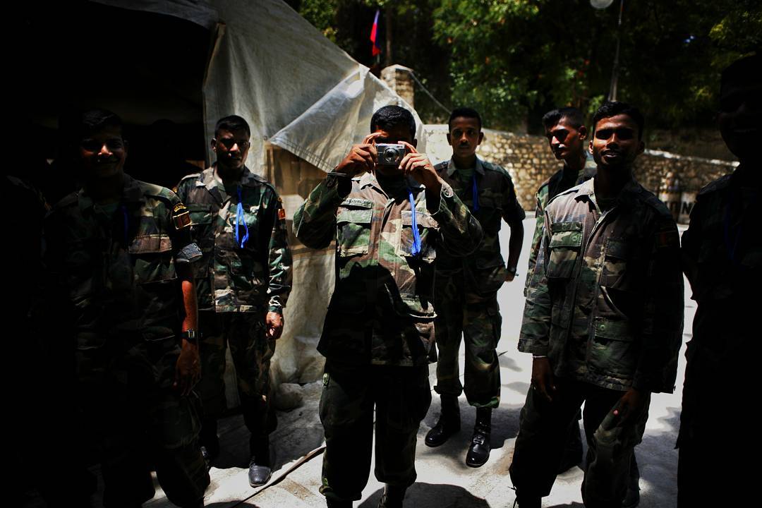 Sri Lankan soldiers working for the UN photograph me in return. Photo 14 of 22