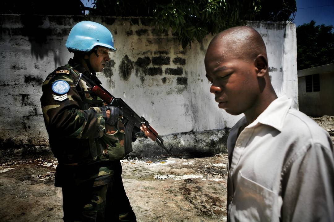 A Sri Lankan soldier working for the UN patrols in and around Cite Soleil in Port au Prince Haiti in 2008. Photo 16 of 2