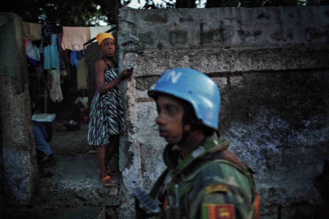 A Sri Lankan soldier working for the UN patrols in and around Cite Soleil in Port au Prince Haiti in 2008. Photo 19 of 2