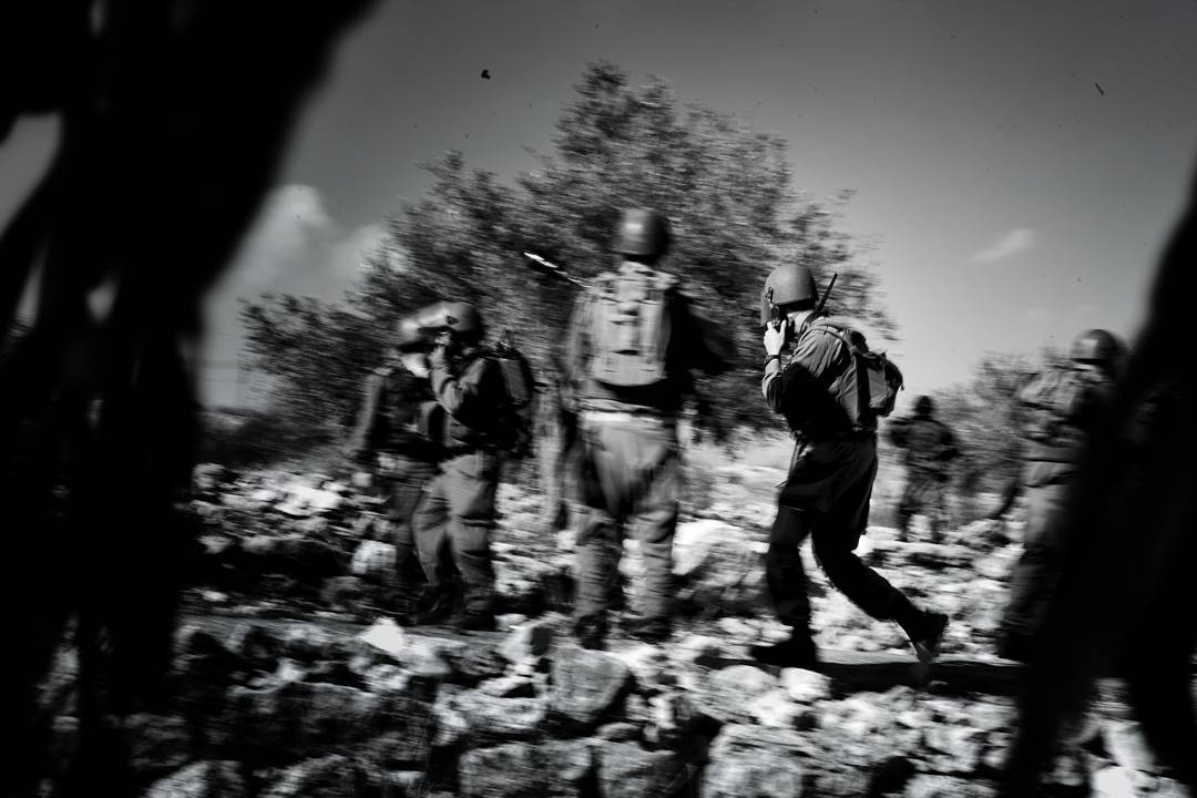 IDF soldiers scramble in response to protestors having a regularly scheduled protest throwing rocks at IDP soldiers at t