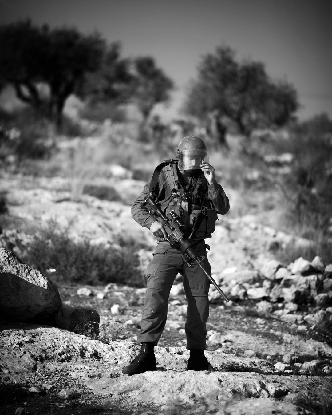A moment of quiet for an IDF soldier near the Palestinian town of Bil'in in the West Bank. Protestors were having a regu